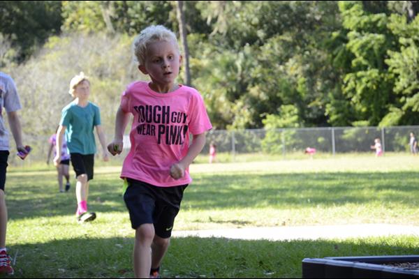 little running boy is wearing pink breast cancer awareness t-shirt